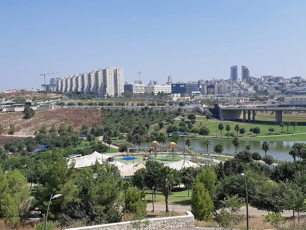 The lake in Anava Park with Modiin's city centre behind it