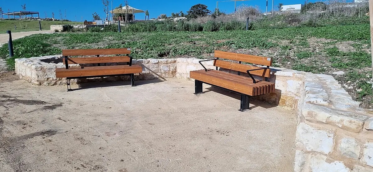 Benches and restored stone walls in the Givat Ashun archaeological park, Modiin