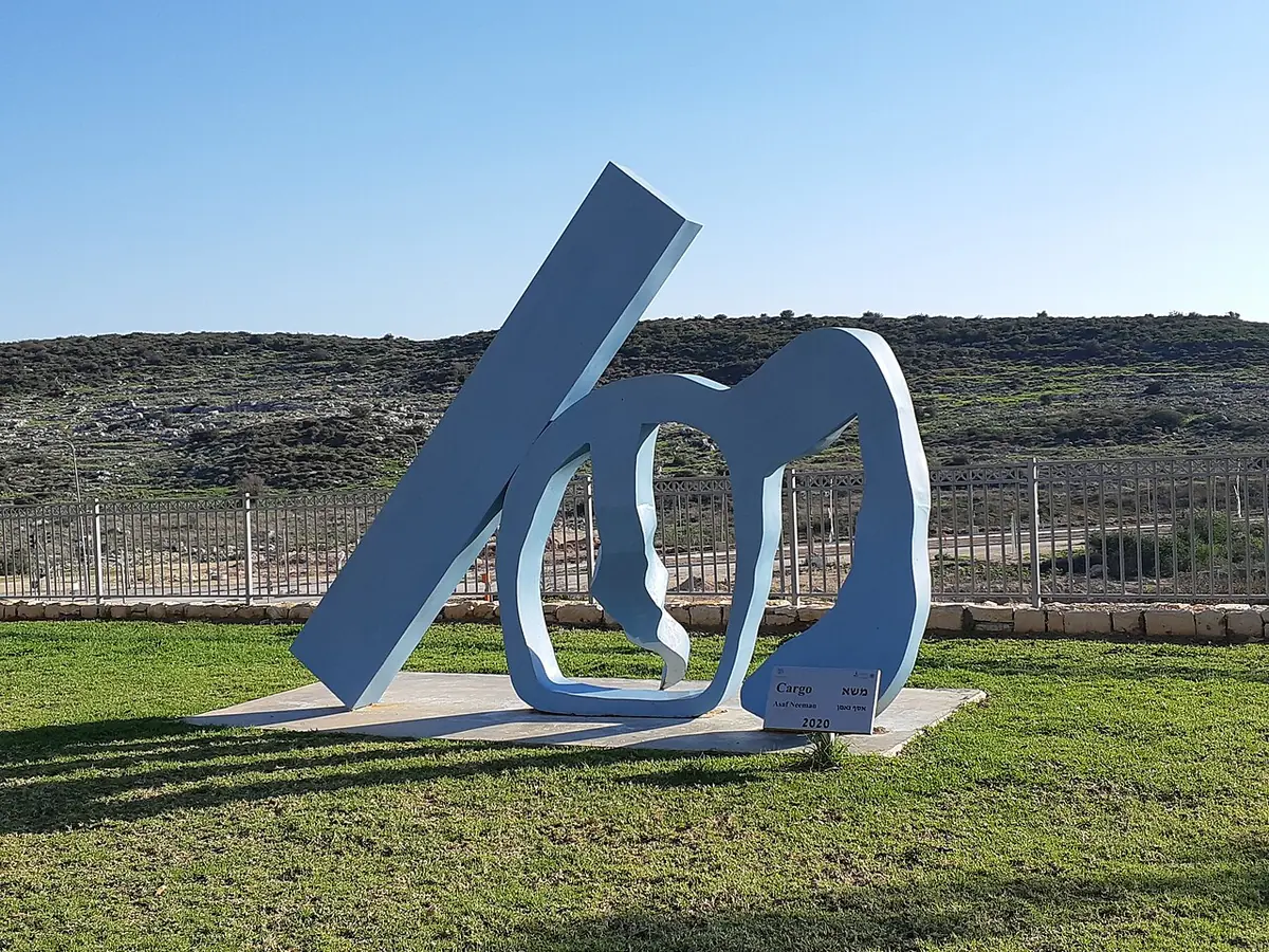 A blue metal sculpture on the lawn of the Nofim neighbourhood park